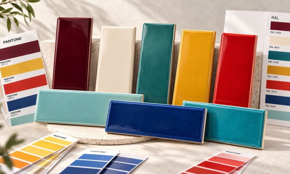 Colour matched glazed ceramic tiles in burgundy, cream, teal, yellow, red and blue alongside Pantone and RAL colour references