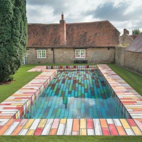 Outdoor swimming pool with custom printed ceramic tiles